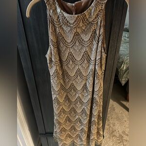 Cute gold dress that can be worn for a night out of a semi formal occasion!!